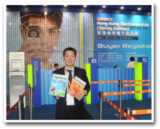 Yu with CENS trade journals at the entrance to the Hong Kong fair. 