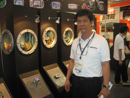 Acewell president George Lee and his company`s top-end weatherproof PTW meters.