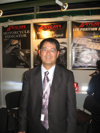 Mycarr chairman Jack Shih and his company`s high-level LED day lights.