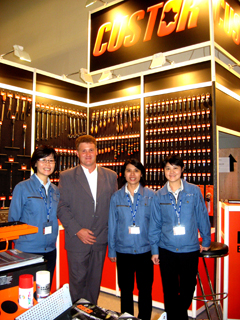 Juliet Lee (second from left), director of Raya, and other company staff stand in front of the Custor brand tools.