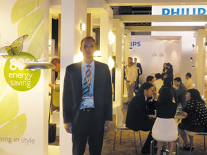 Philips` Eric de Boer introduces the company`s energy-saving consumer luminaires to visitors.