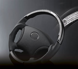 A high-end wood/leather steering wheel studded with Swarovski crystals. 