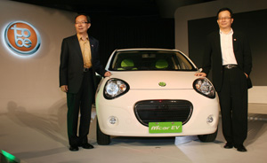 Yulon president Chen Kuo-rong stands beside the tobe M`car mini-car developed by Geely of China and assembled in Taiwan by Yulon.