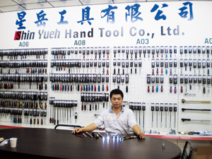Shin Yueh’s sales manager H.W. Lin shows the new LED-incorporated adaptor and extender.