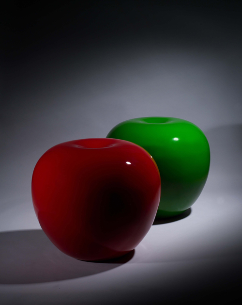 These stylish apple-shaped chairs are made of glass fiber.