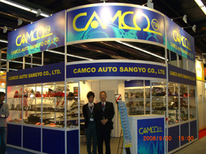 Bruce Liu (right), chairman of Camco, seen at his company`s booth in a major auto-parts fair.