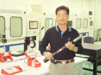 William Tools's chairman William Chiang holds the prototype of the newest semi-powered digital torque wrench.