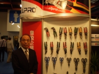 Allpro's chairman David Huang points out the newly developed super-hard steel of the shear blades.