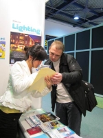CENS representative helps a buyer fill out CENS inquiry form at Interlight Moscow
