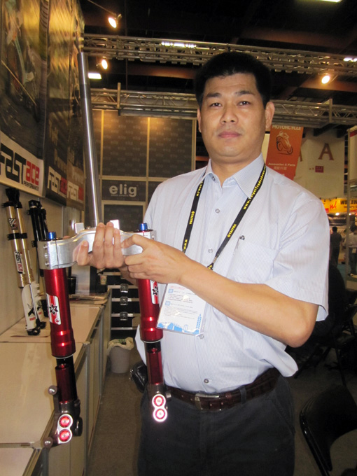 Chengfeng president Lee with his company`s four-function adjustable front shock.