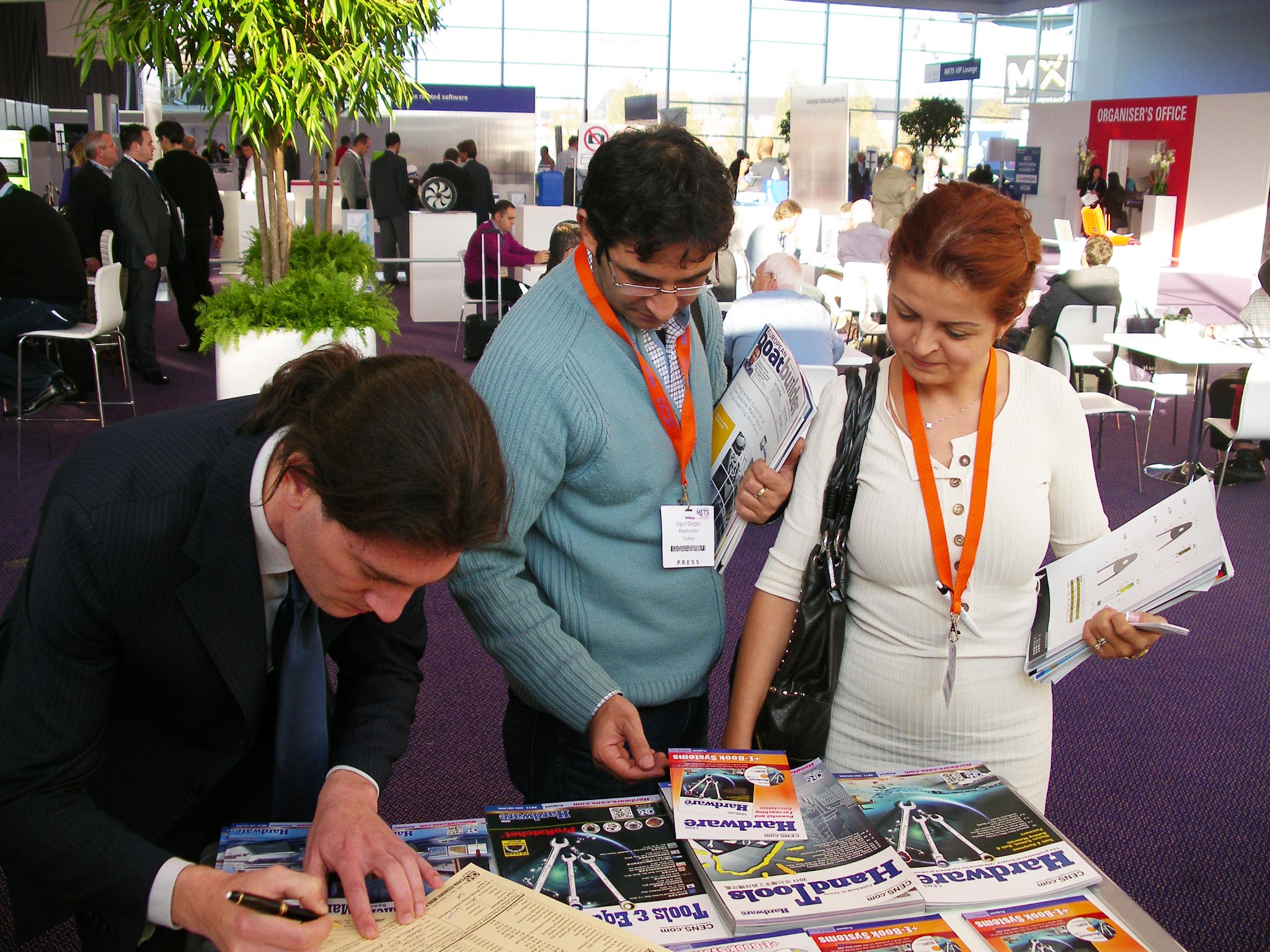 Visitors browse CENS publications at METS.