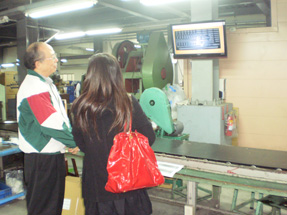 Chen shows an LCD monitor beside the production line to display necessary data to enhance worker’s efficiency and minimize manufacturing error.