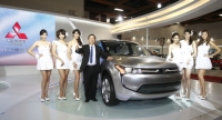 CMC president H.T Liu with a Mitsubishi SUV concept.