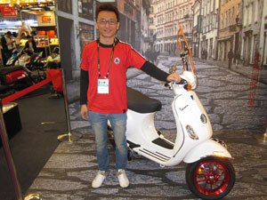 Lee Chiou-ren, NCY`s R&D manager, showcases parts and accessories developed for the Vespa LX125.