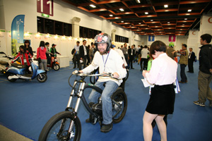 Showgoers test drive vehicles on display at EV Taiwan 2013.