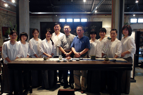 Lin Ming-san (fifth left) is one of the top collectors of Chinese antique furniture in Taiwan today. On his right is William Jiang, curator of the Furniture Manufacturing Eco-Museum in Tainan.