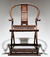 This folding Ming-style chair is a typical example of the structure and woodworking techniques of Ming-Dynasty furniture.