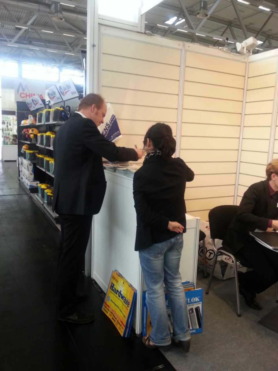 A local buyer inquiring about products at CENS booth at Spoga + Gafa 2013.