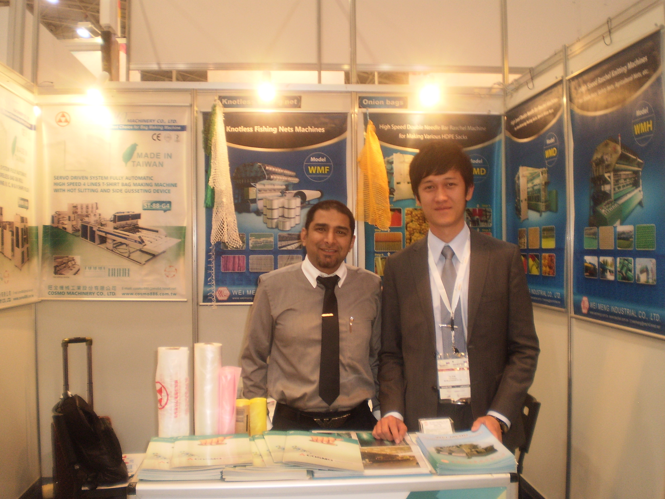 Yazar Khan, Cosmo's sales and marketing manager (left), and Sam Yu, mechanical engineer at Wei Meng, pose at the booth shared by the two companies.