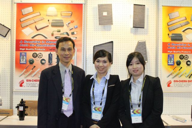 Gin-Chern's president Wu Ming-kuo (left), and company staff at the 2014 Taipei AMAP company booth.