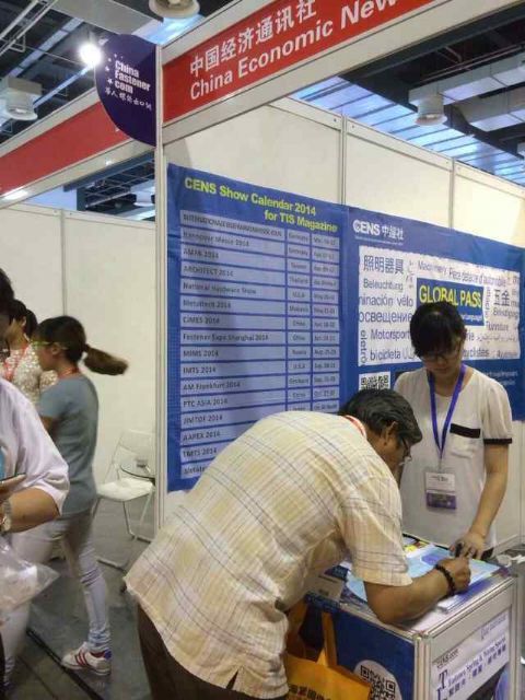 A buyer fills out CENS inquiry form at Fastener Expo Shanghai.   