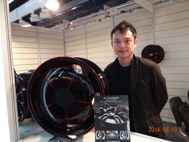 Kyo Wa sales representative Bruce Wu introduces the firm's new series of wheels aimed at demand for personalization among car lovers.