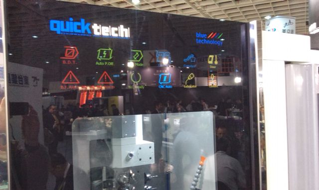 Quick Tech's CNC turning-milling combo with 12 icons on  tempered-glass door show 12 operating modes.