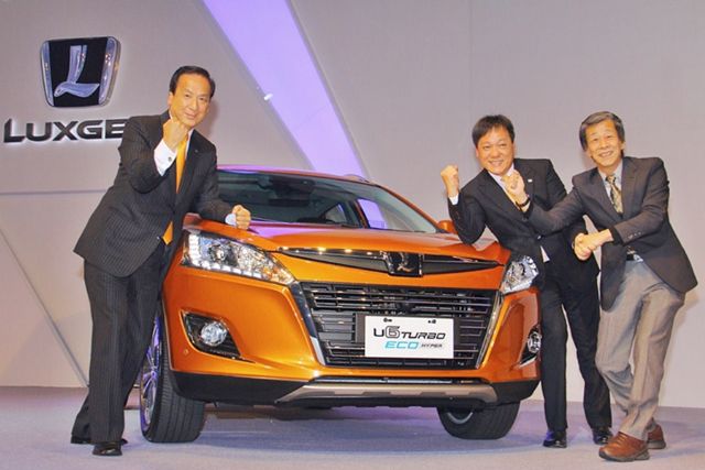 Hu Kai-chang (left), president of Luxgen Motor, and Mizuno Kazutoshi (right), former chief design engineer and "God Father" of Nissan GT-R, as well as new CEO of HAITEC, announce the new Luxgen U6 Turbo Eco crossover. 