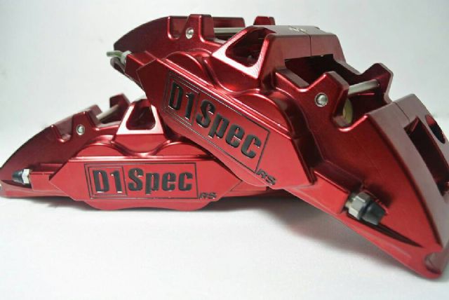 A top-end forged 4-piston brake caliper from D1 SPEC, a maker of high-end performance tuning auto parts.
