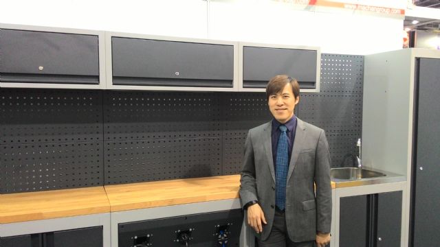 Machan Vice President Brian Chang with the company's modularized storage system. 