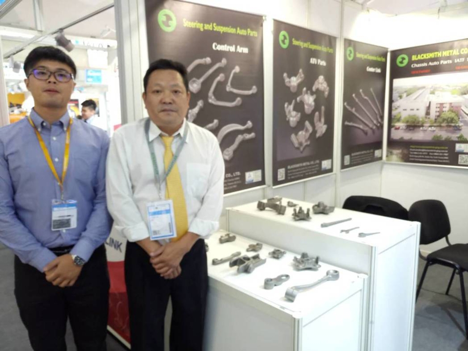 Blacksmith Metal Co. Ltd. Vice General Manager Lin Hung-Ru (right) poses beside their products. (photo courtesy of Lisa Kuo)