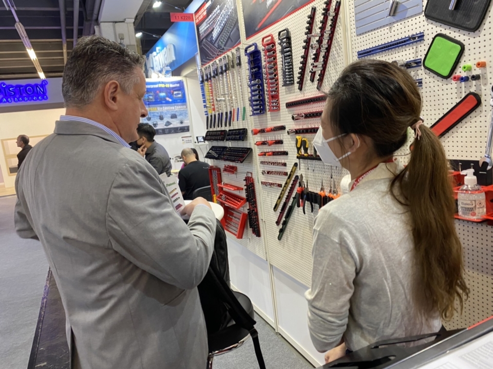 Buyers inquired Organizer Precision booth staff about its tool storage products. (Photo courtesy of Organizer Precision)