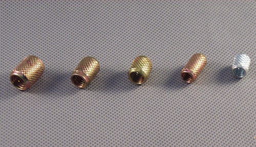 Embossed threaded inserts