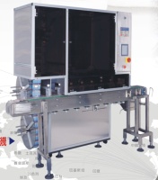 AUTO. HI.-SPEED LABEL/ TAMPER-EVIDENT SLEEVING MACHINE